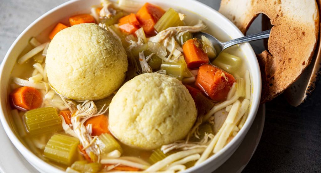 A bowl of kosher matzo ball soup with chicken from Chompie's in Phoenix