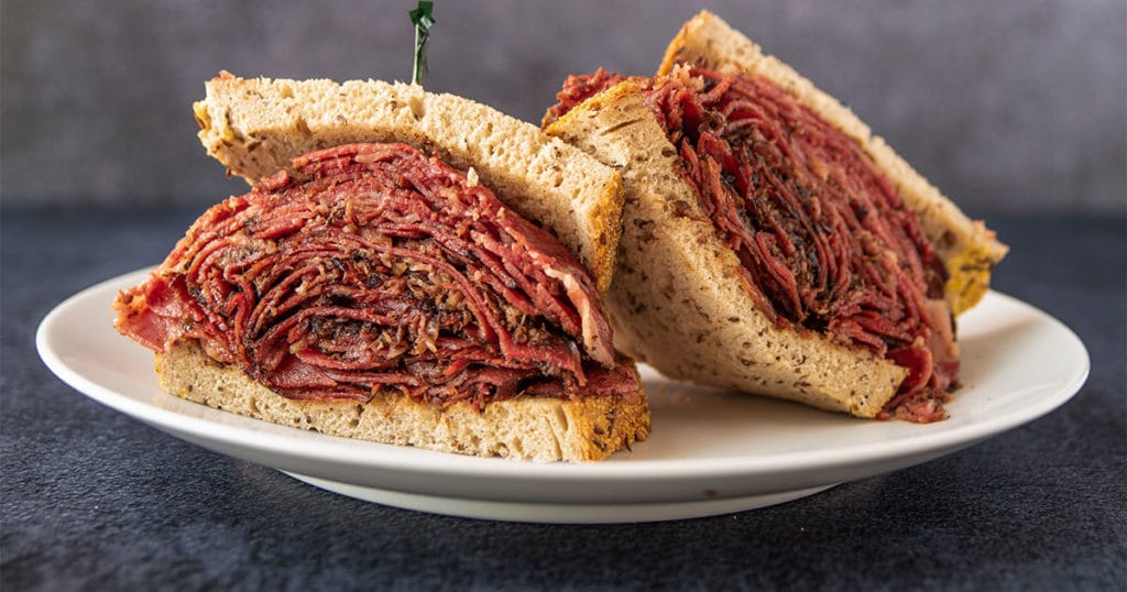 A plate of New York City Style Pastrami sandwich from Chompie's