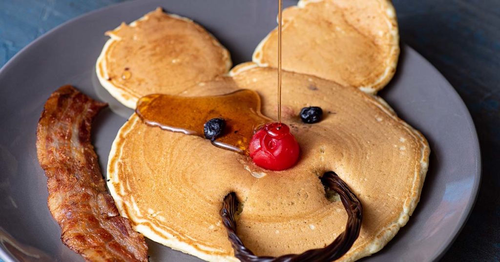 Kids meal at a restaurant with pancakes in the shape of a mouse
